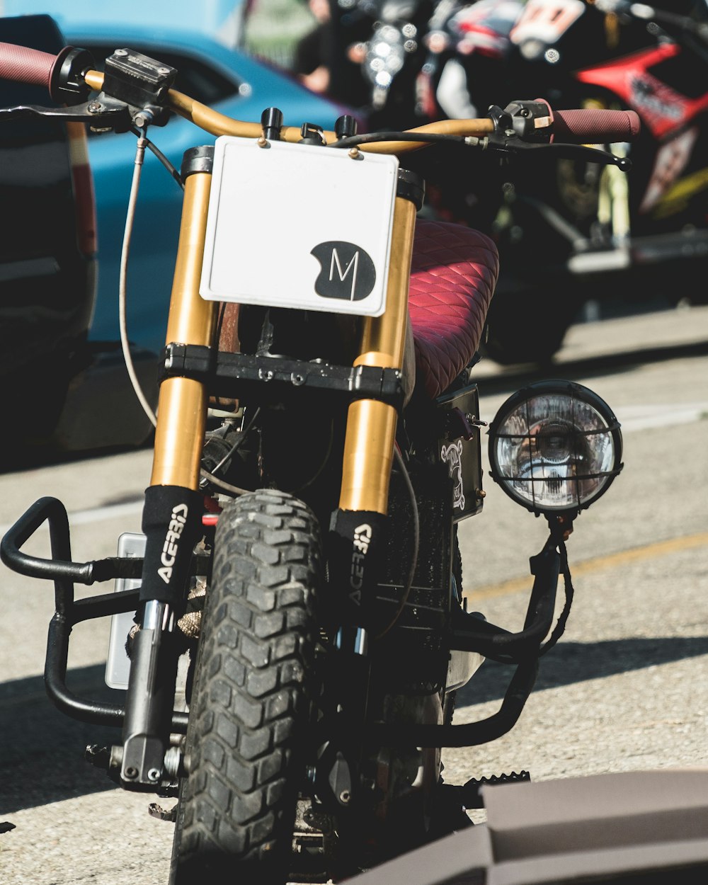 motorcycle parked standing on pavement