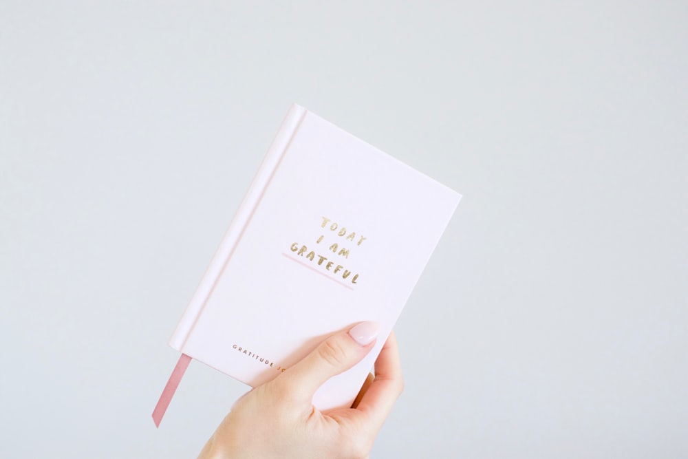 person holding book