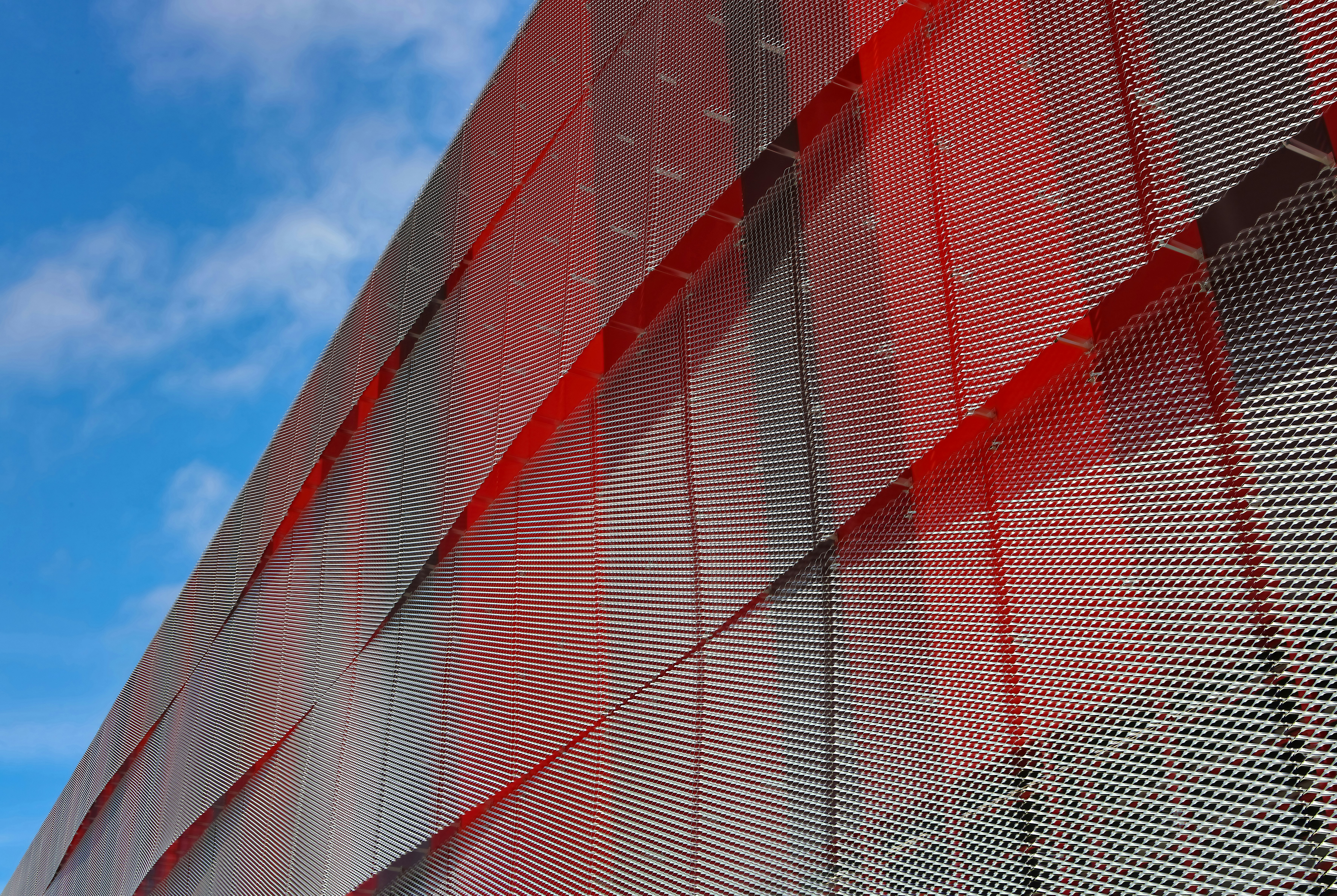 a close up of a building with a sky in the background