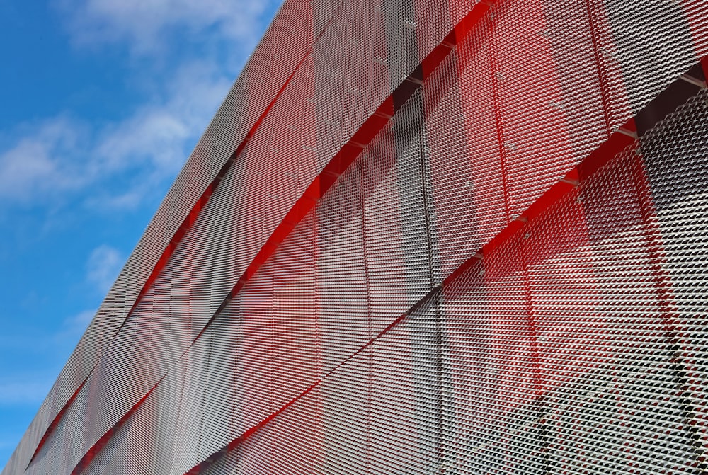 a close up of a building with a sky in the background