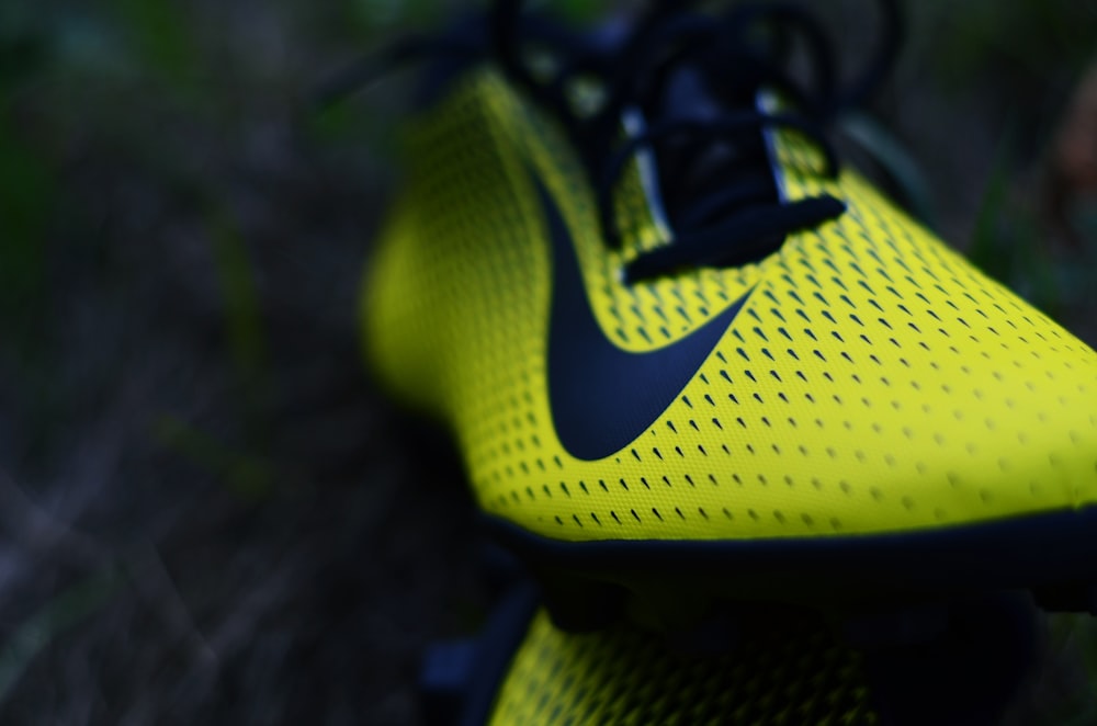 pair of yellow Nike cleats