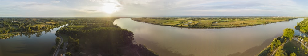 body of water near trees at daytime