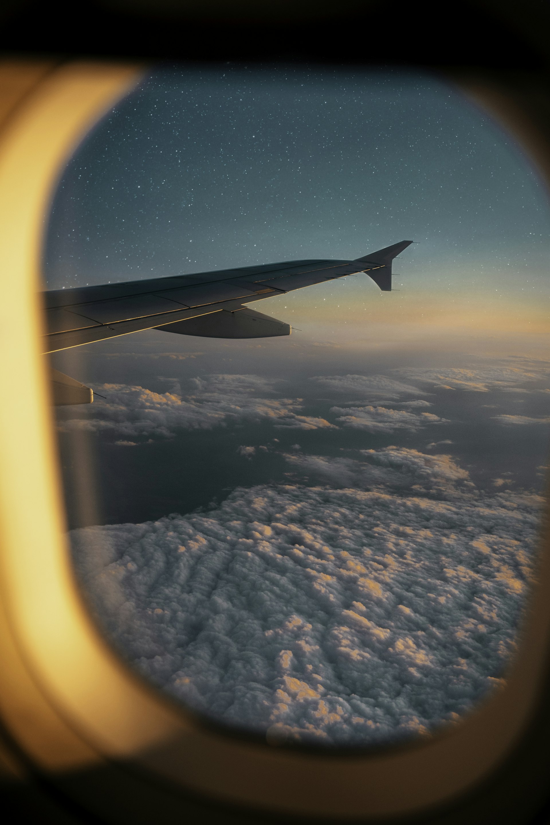 Soft white clouds seen through an airplane window
