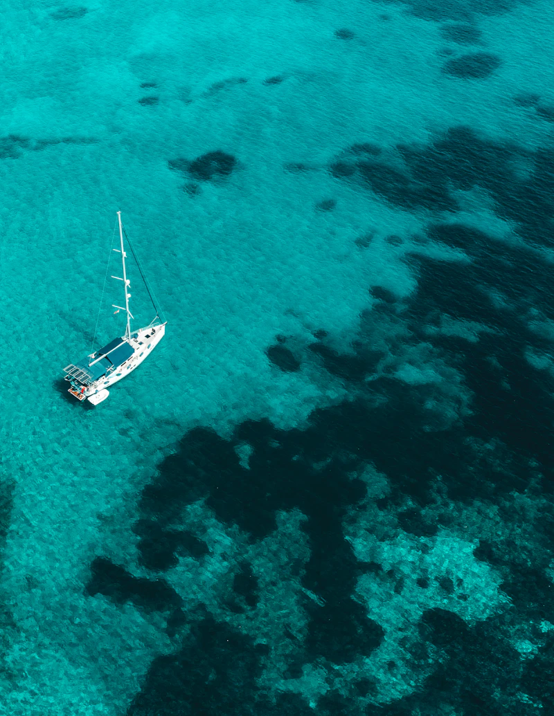 A sailing boat on a tropical lagoon
