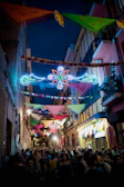 Colorful decorations and lights illuminating a night event in the mahal.