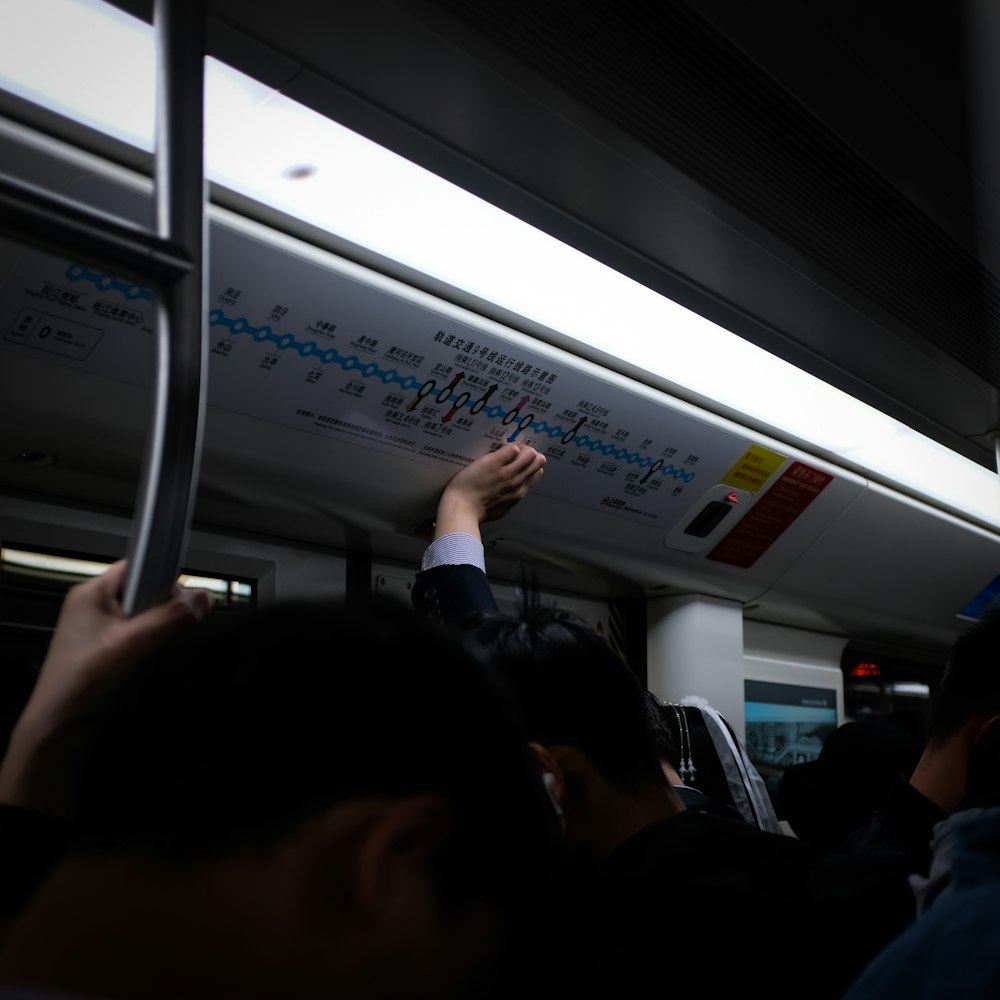 man standing in train