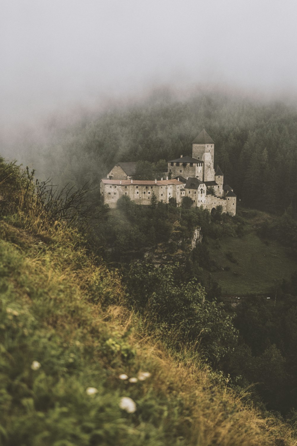 concrete building on mountain hill