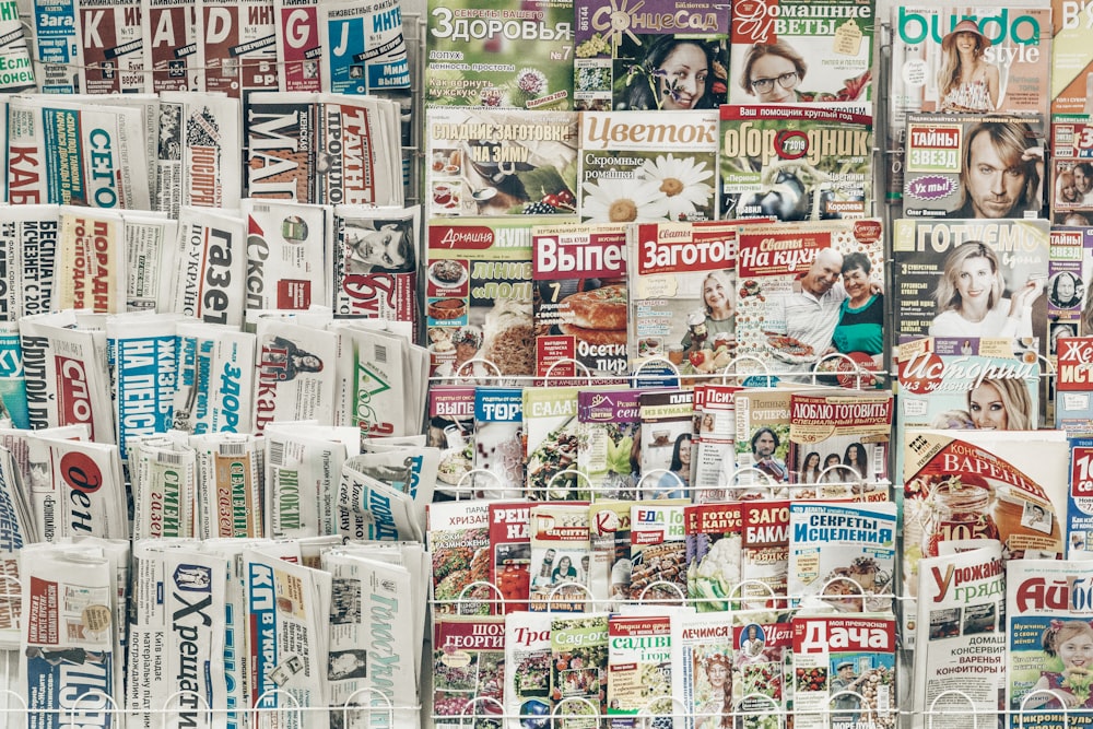 assorted-title magazines displayed on stand