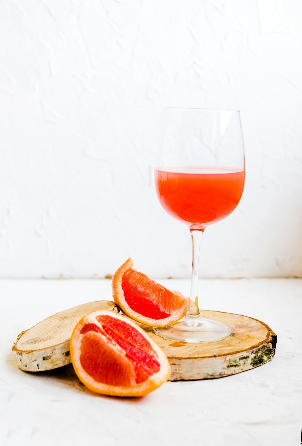 fruit slices beside near empty drinking glass