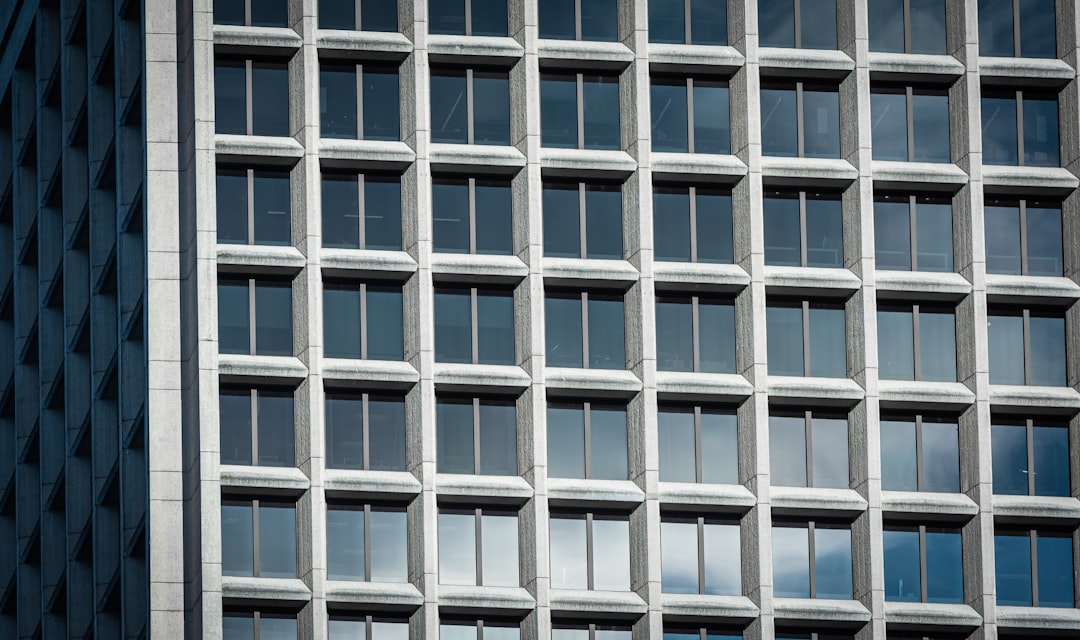 blue and white glass high-rise building,