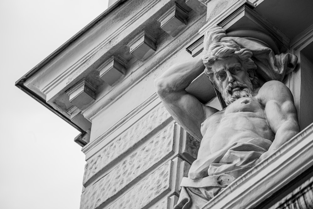 gray-scale photo of male statue