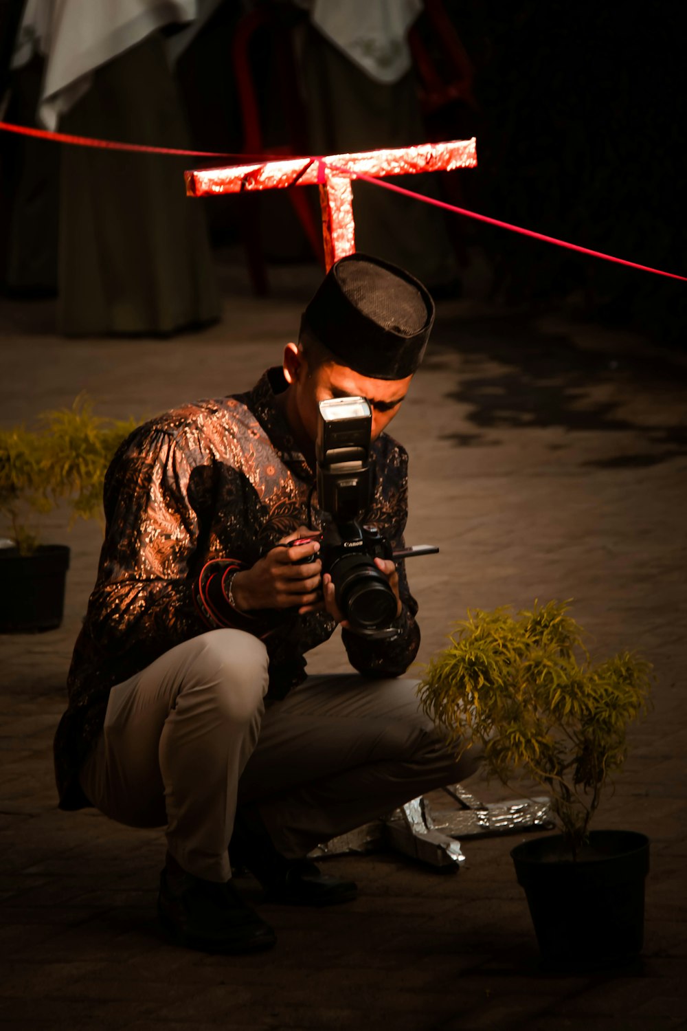 man using black DSLR camera