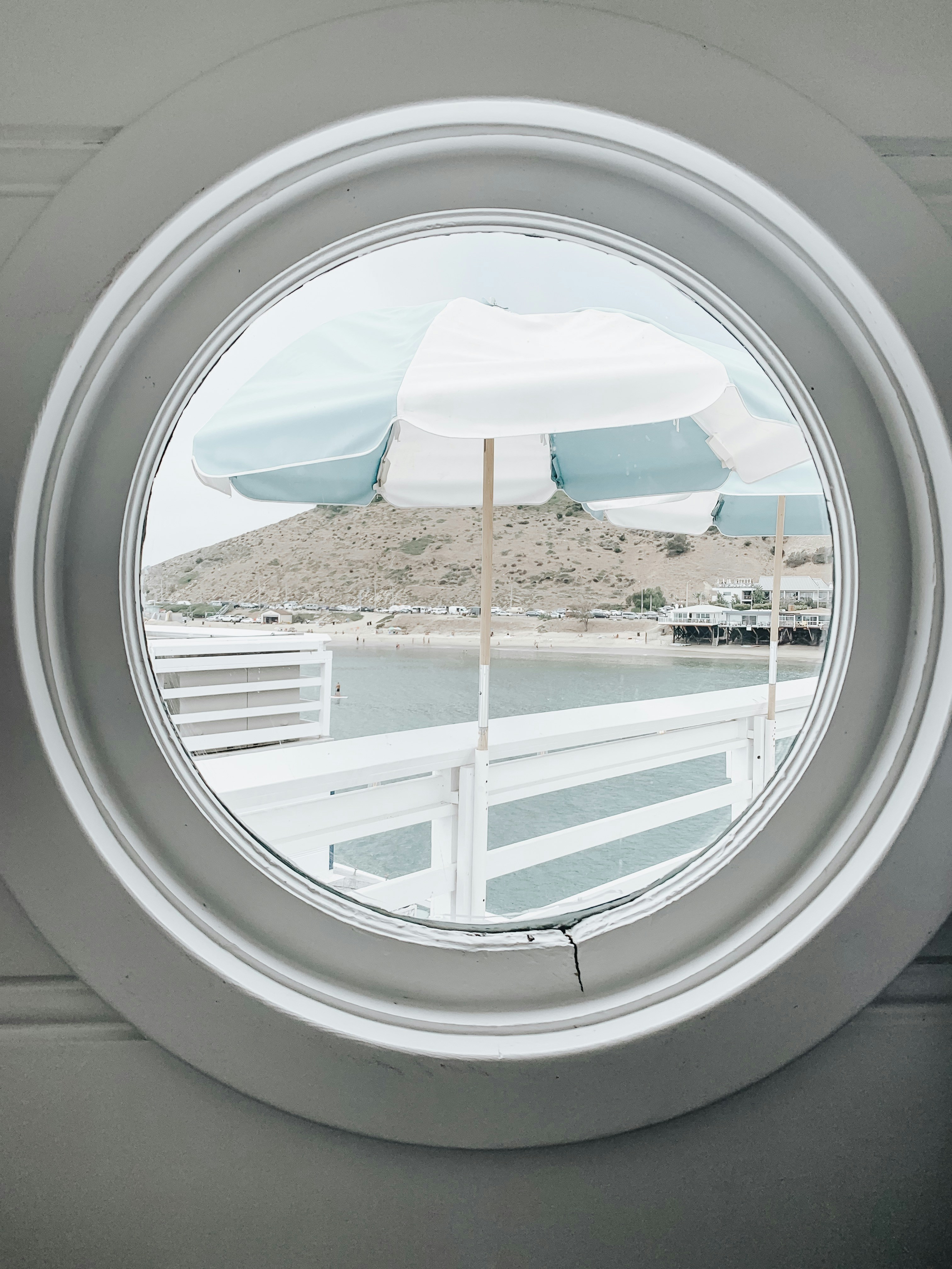 White And Gray Striped Patio Umbrella Photo Free Window Image On Unsplash