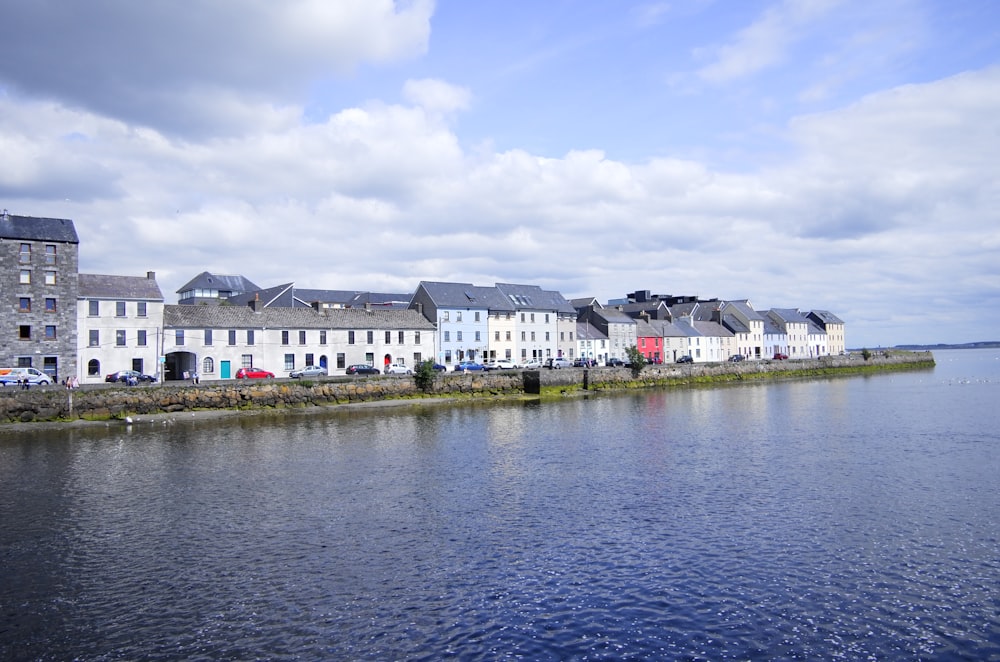 white houses facing body of water