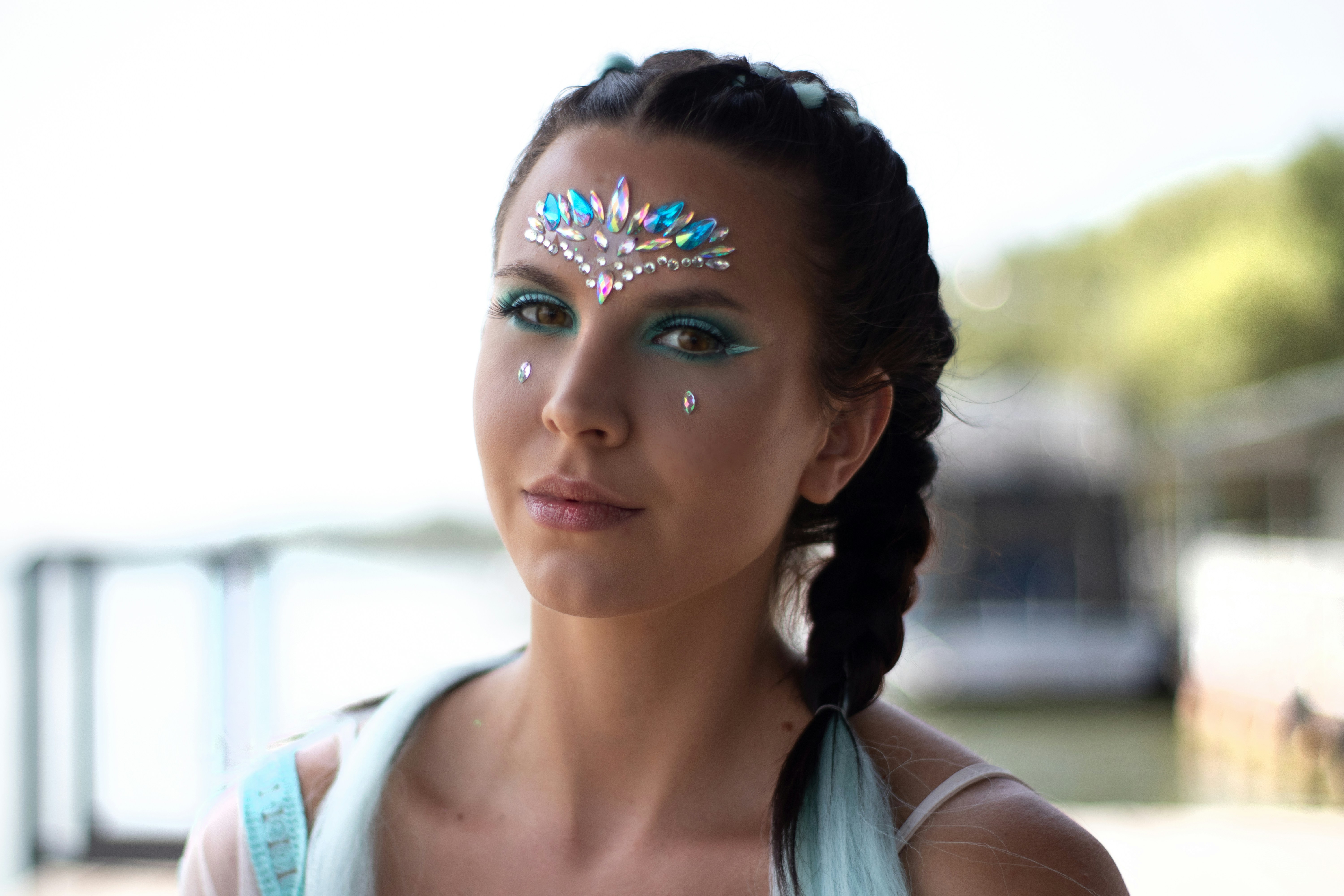 Festival attendee wearing Beatnix Costume Shop costume jewelry under colorful event lighting