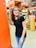 An image showing a satisfied customer in a hardware store aisle.