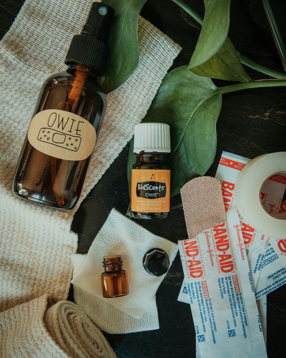 flat lay photo of band-aids and ointment bottle