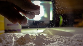 Close-up of white starch powder being processed in a clean industrial setting.