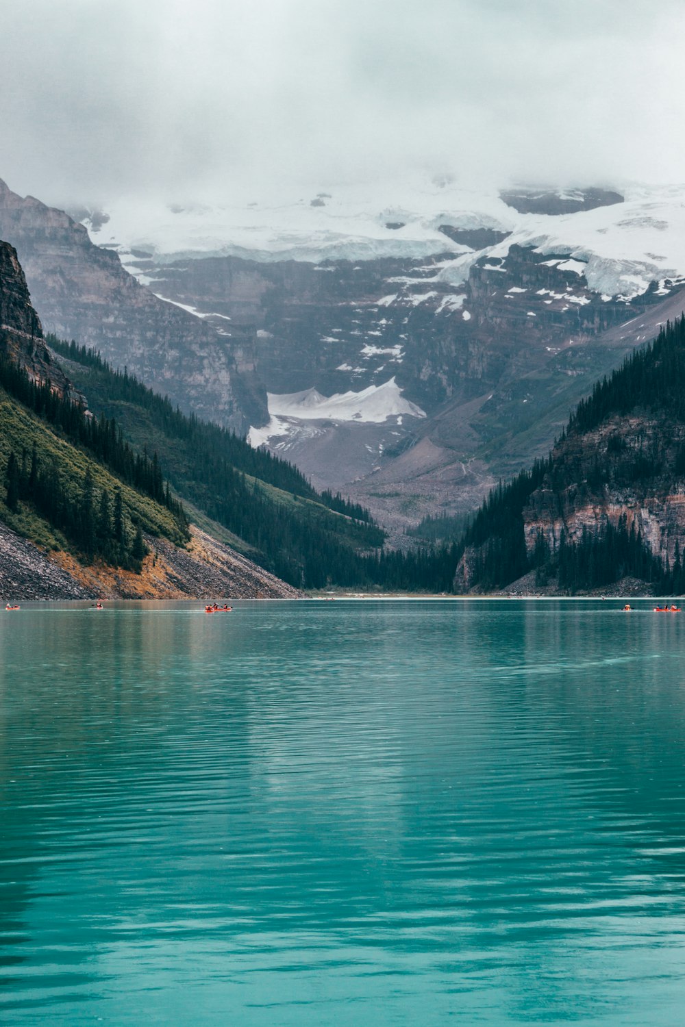 people in boats in lake