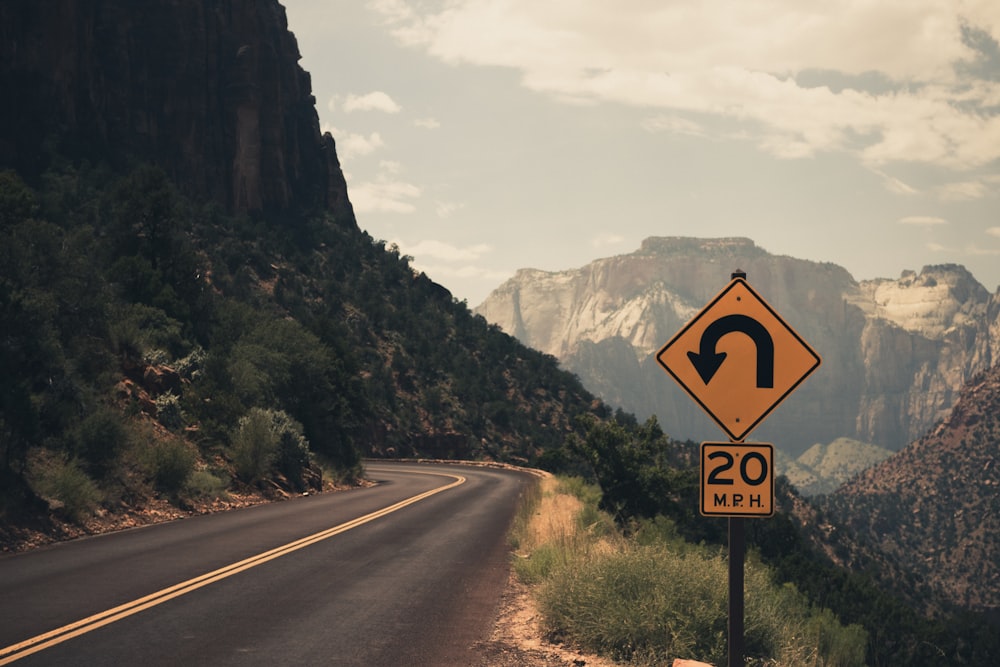 gray cement road at a mountainside