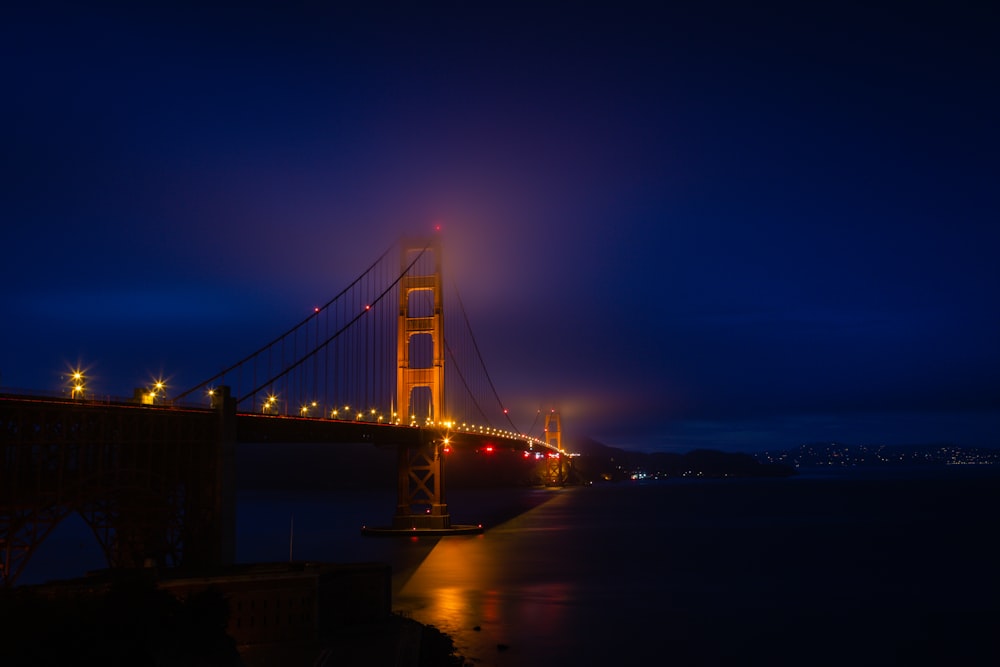 brown and black bridge at nighttime