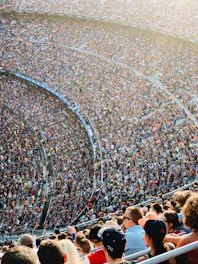 people sitting inside stadium seats
