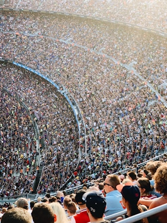 Fans seated in arena stands watching a game, similar to a group outing in the seating bowl at Lee's Family Forum in Henderson