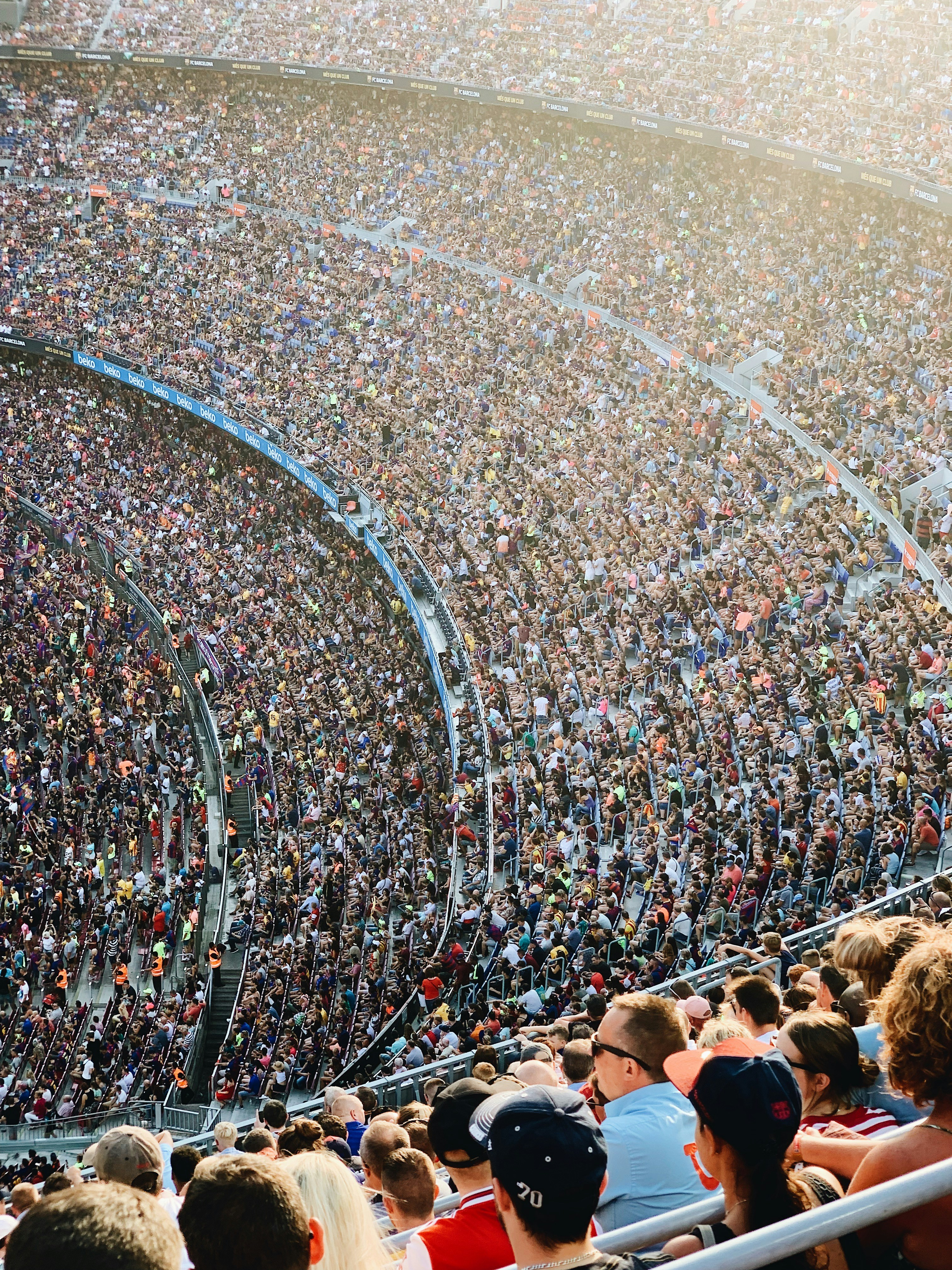 people sitting inside stadium seats