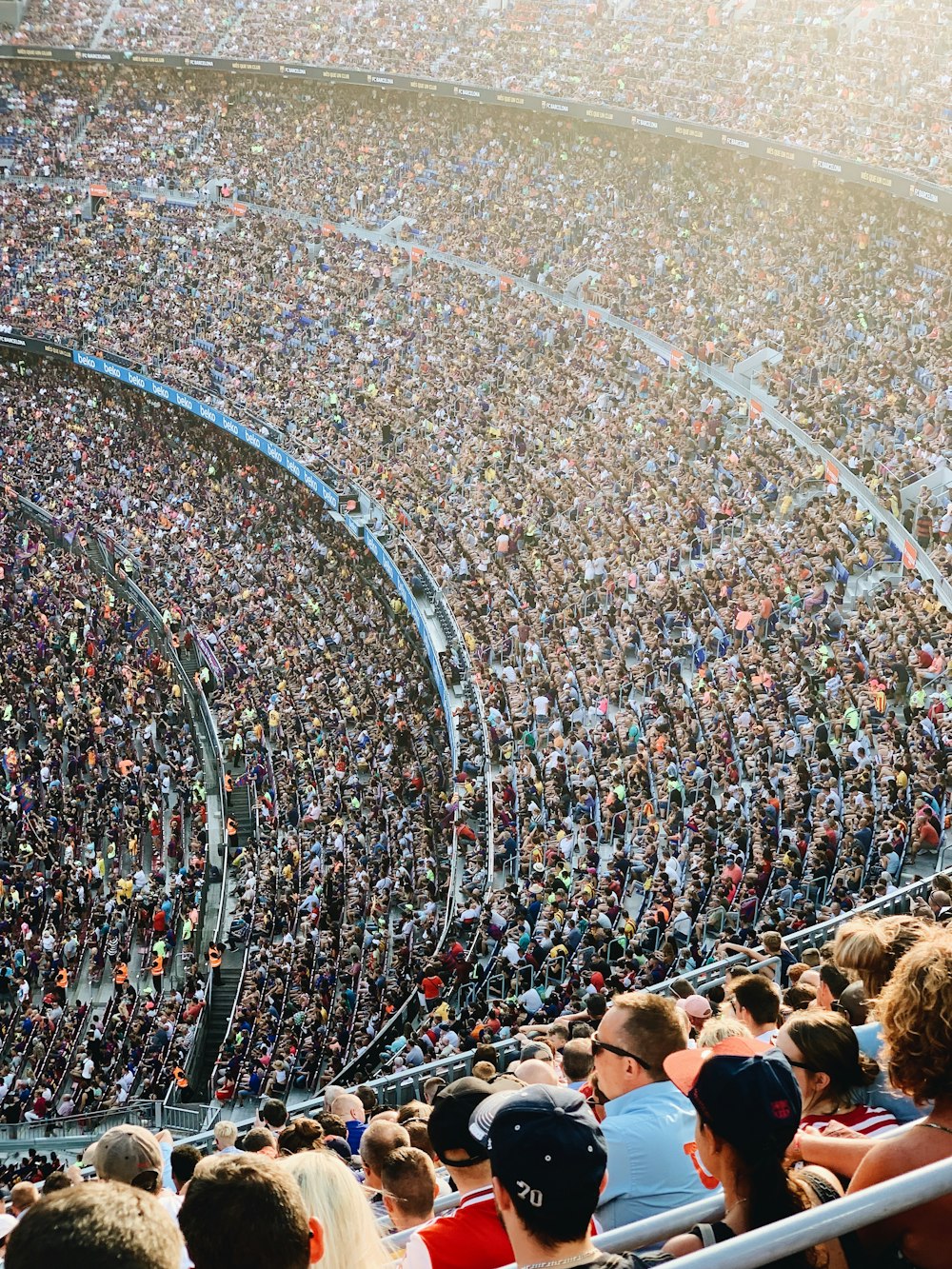 people sitting inside stadium seats