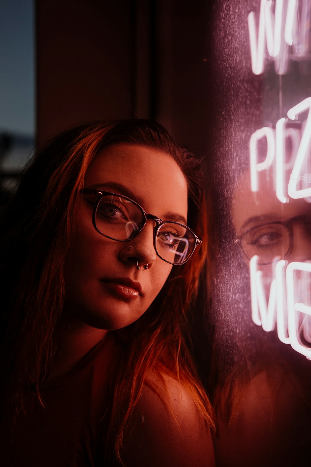 woman near NEON signage