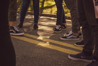 A diverse group of people enjoying outdoor activities in comfortable sneakers.