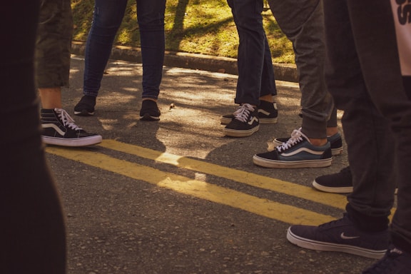A diverse group of people enjoying outdoor activities in comfortable sneakers.