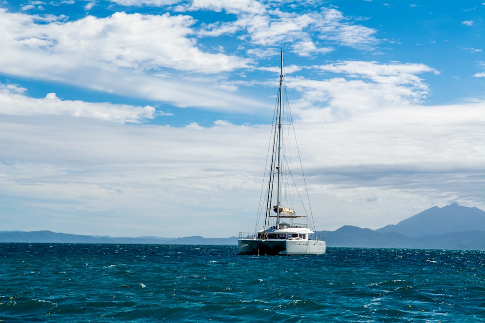 white boat on body of water