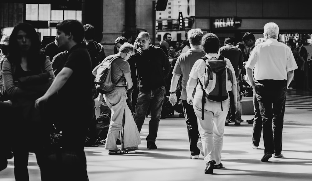 grayscale photography of people near outdoor during daytime