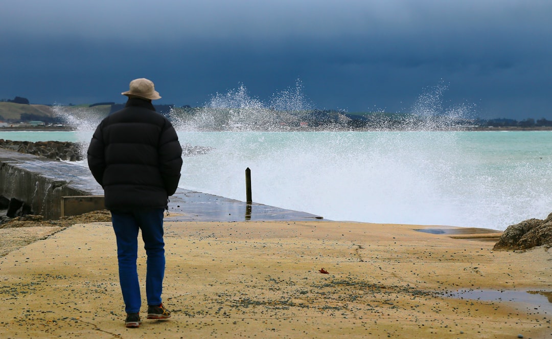 man walking near splashing water