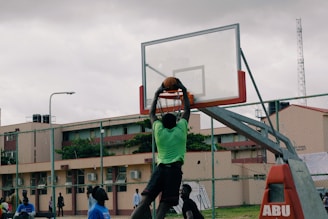 man dunking the basketball