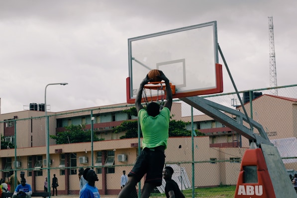 man dunking the basketball