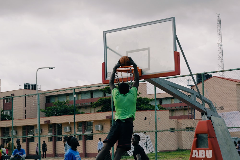 man dunking the basketball