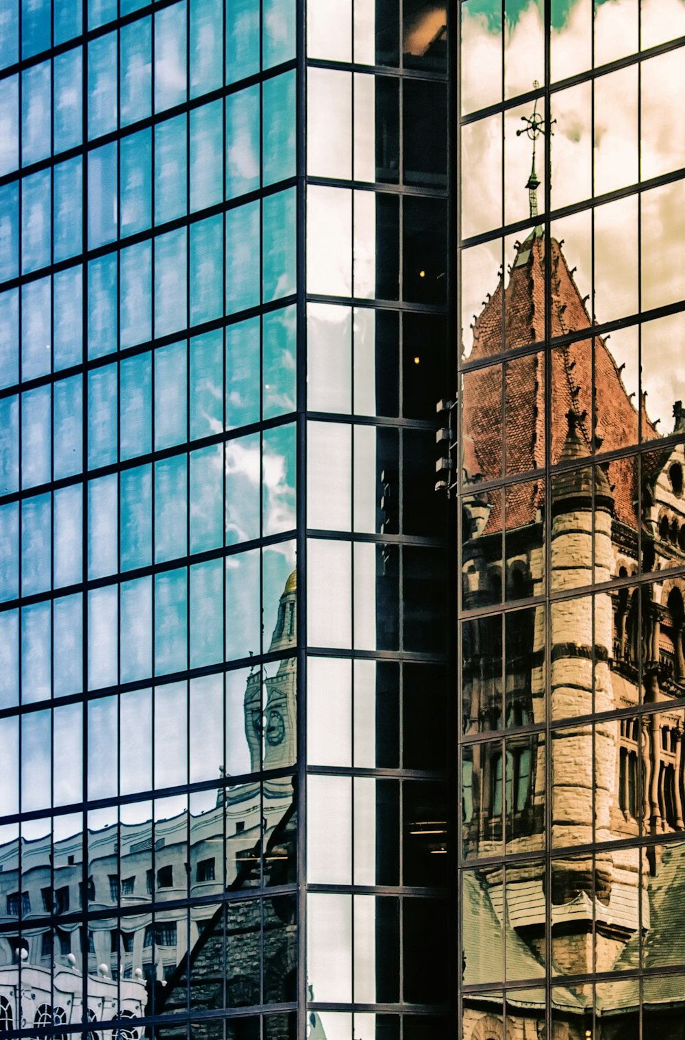 curtain-wall high-rise building during daytime