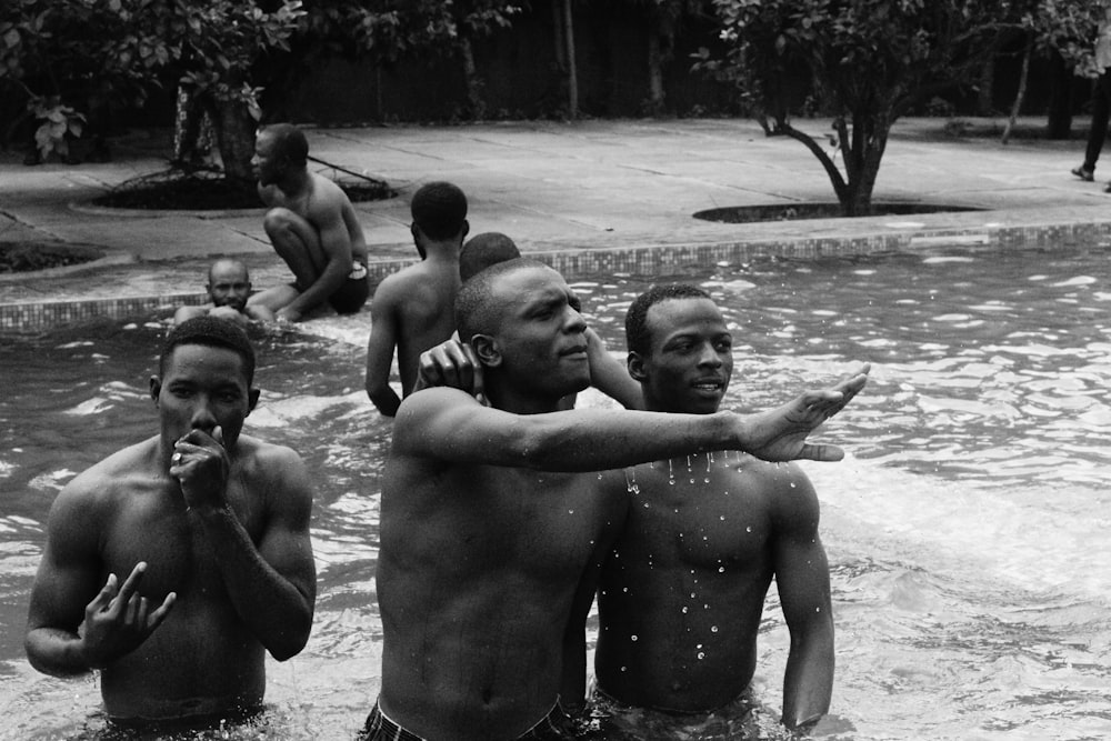 man in pool grayscale photography