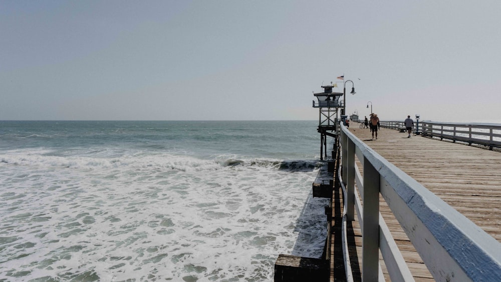 people walking on dock during daytime