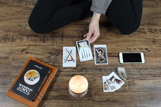 person playing with tarrot cards