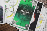 A sketch-style rendering of the Knight of Pentacles holding his pentacle contemplatively.