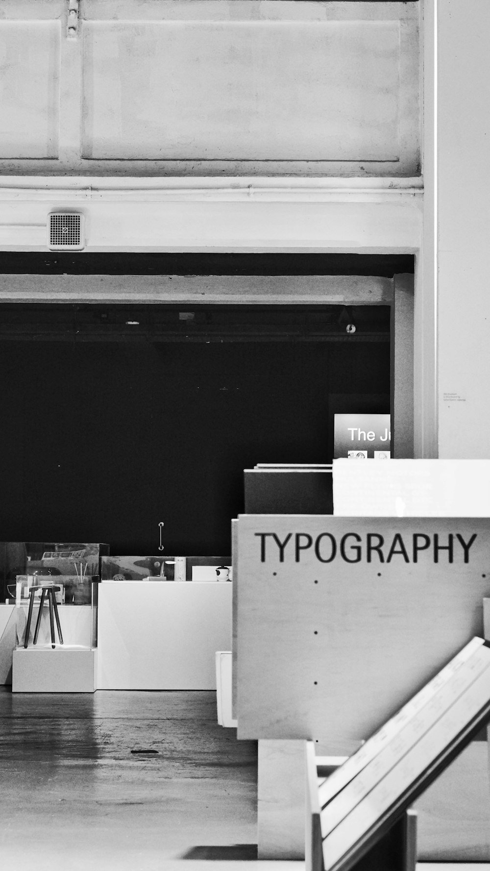 a black and white photo of a pile of books