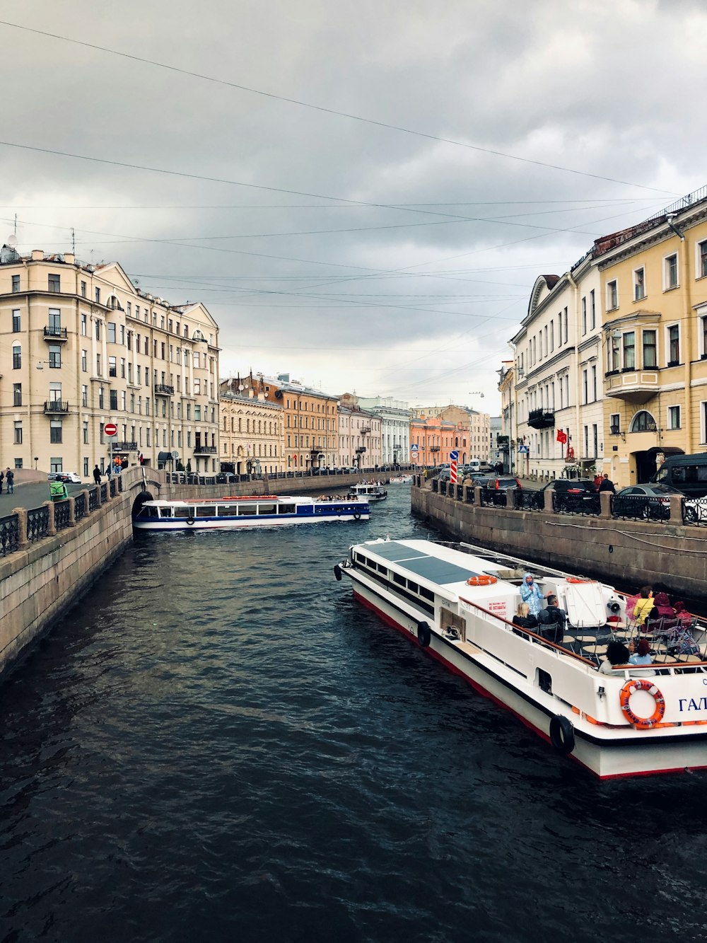 boat in body of water between buildings