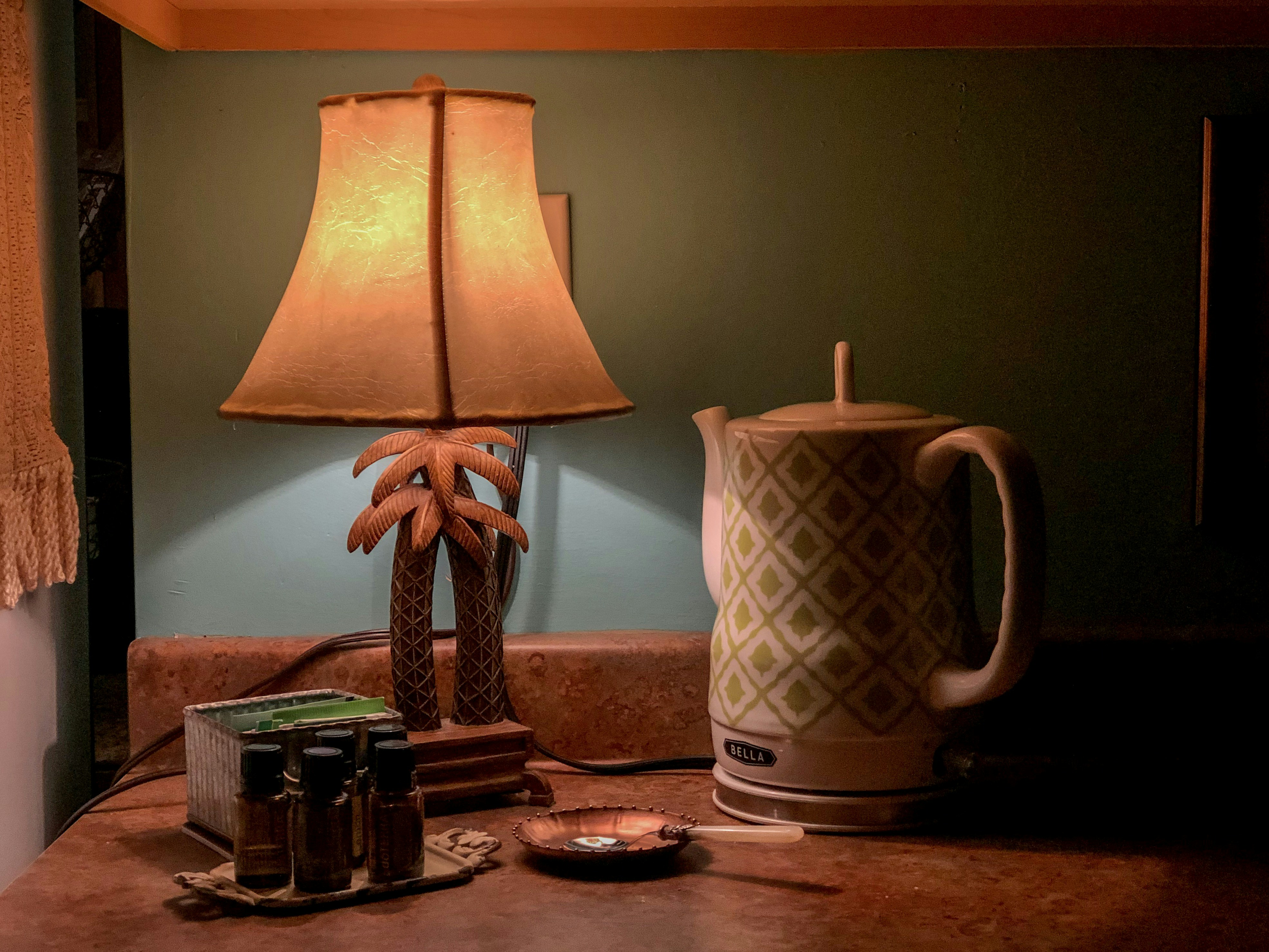 white and brown table lamp close-up photography