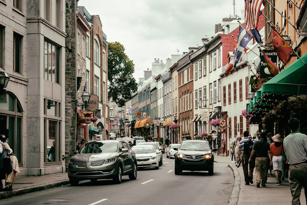 vehicles on road, a busy Old Québec street