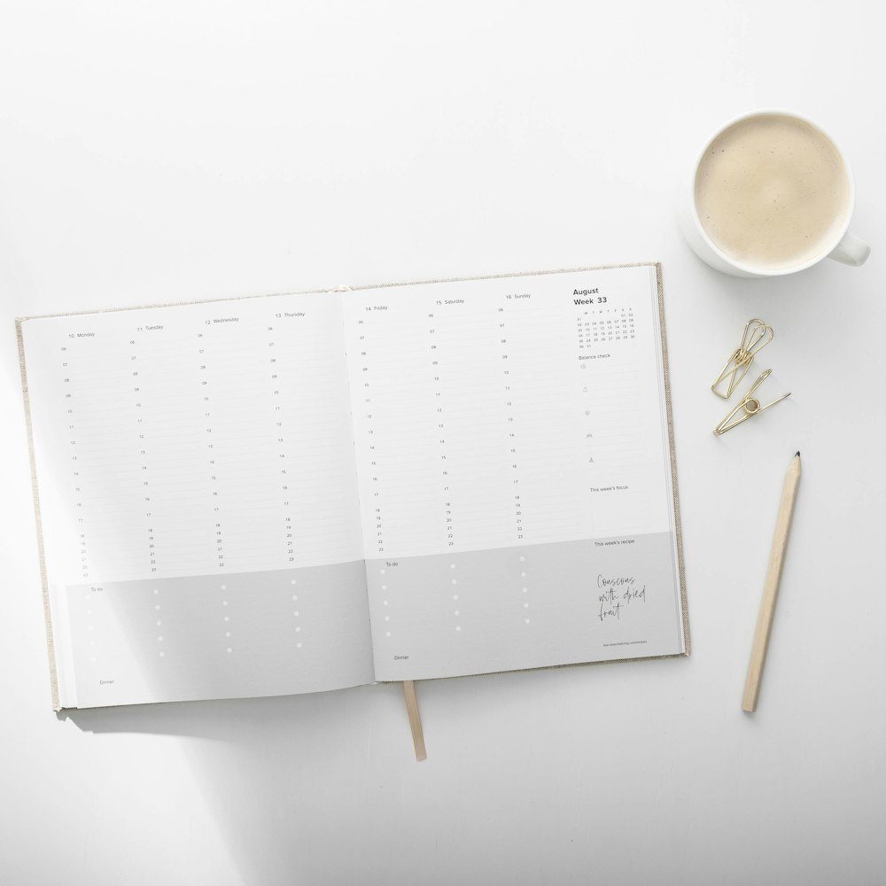 white and brown planner