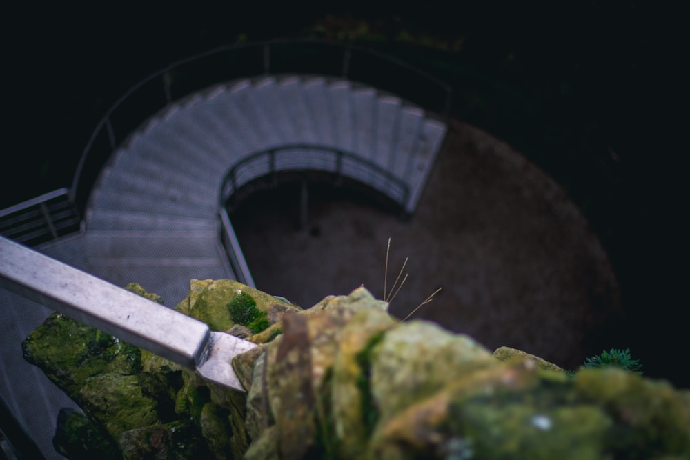 a close up of a knife cutting a piece of lettuce