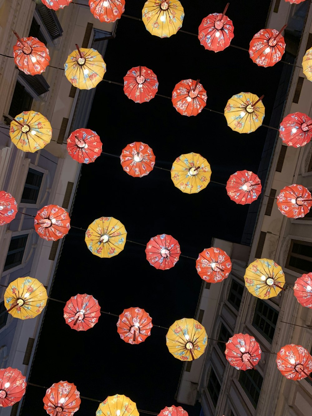 bunch of red and yellow paper lanterns during nighttime